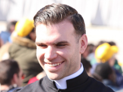 smiling catholic priest